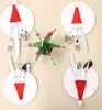 Christmas-themed table setting with plates, cutlery, and a decorative centerpiece. Náhled obrázku produktu