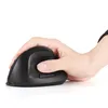 A hand holding a black vertical ergonomic mouse against a white background. Produktbild-Vorschau