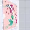 A pink shower panel with a mermaid illustration and a showerhead spraying water. The background is a tiled wall. Anteprima dell’immagine prodotto