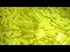 A close-up view of many small, yellow, rectangular objects, possibly highlighter pen ink sticks or similar material. Anteprima dell’immagine prodotto