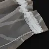Close-up view of the hem of two sheer curtains with a striped pattern. Produktbild-Vorschau