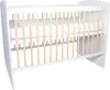 A white baby crib with wooden slats and a white mattress. Produktbild-Vorschau