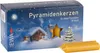 A box of pyramid candles with a winter scene on the packaging, and two candles in the foreground. Produktbild-Vorschau