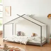 A child's bed with a house frame and canopy, decorated with stuffed animals and bedding, in a bedroom setting. Produktbild-Vorschau