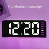 A digital alarm clock with a bright LED display and colorful lighting. Produktbild-Vorschau