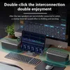 Two speakers are set up on a desk with a computer monitor and tablet displaying audio mixing software. Produktbild-Vorschau