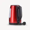 A red electric kettle with a black handle and plug, shown from the side against a white background. Anteprima dell’immagine prodotto