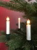 Three candle-shaped lights on a Christmas tree. Produktbild-Vorschau
