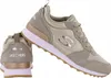 A pair of Skechers OG 85 sneakers in gold and olive green. Voir les images du produit