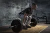 A man is performing a deadlift in a gym setting. Náhľad obrázku produktu