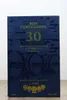A close-up of a dark blue box with gold lettering and images of barrels, advertising a 30-year-old rum. Produktbild-Vorschau