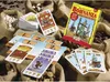 A board game box and cards are arranged on a surface with bags of beans. Anteprima dell’immagine prodotto