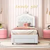 A child's bedroom with a white bed, pink nightstands, and decorative elements. Voir les images du produit