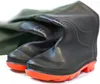 A pair of black rubber waders with orange soles and a green fabric top, lying on a white surface. Produktbild-Vorschau
