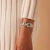 A close-up shot of a person's arm wearing a silver Casio watch. Produktbild-Vorschau