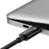 A close-up shot of a black USB-C cable plugged into a silver laptop. Náhľad obrázku produktu