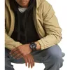 A person wearing a watch, jacket, and hoodie. Produktbild-Vorschau