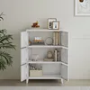 A white cabinet with three shelves, filled with decorative items and books. Podgląd zdjęcia produktu