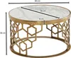 A round coffee table with a marble top and a gold metal base with a geometric pattern. Produktbild-Vorschau