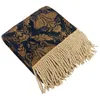 A folded throw blanket with a damask pattern and fringe. Produktbild-Vorschau