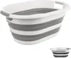 A collapsible laundry basket with gray and white stripes. Produktbild-Vorschau