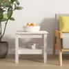 A white wooden side table with a bowl of fruit and books on a shelf, next to a chair with a yellow cushion. Náhľad obrázku produktu