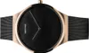 A close-up, top-down view of a Bering men's watch with a black dial and rose gold casing and mesh strap. Náhled obrázku produktu