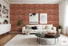 A living room with a brick wall, sofa, coffee table, and shelves. Anteprima dell’immagine prodotto
