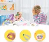 Two young girls are playing with colorful beads at a table, with a product box and shelves of toys in the background. Náhled obrázku produktu