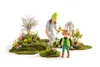 A Playmobil gardener figure and a child figure are shown in a garden setting with moss and flowers. Náhľad obrázku produktu