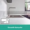A modern kitchen sink with a faucet running water. Produktbild-Vorschau