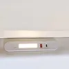 A close-up view of a white bedside panel with integrated lighting and USB ports. Produktbild-Vorschau
