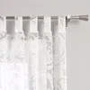 A close-up view of white sheer curtains with a damask pattern hanging on a curtain rod. Produktbild-Vorschau