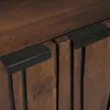 A close-up view of two cabinet doors with black handles. Voir les images du produit