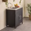 An outdoor kitchen unit with a sink and faucet, set against a neutral wall. Anteprima dell’immagine prodotto