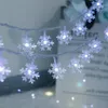 A close-up of a string of snowflake-shaped LED lights. Náhled obrázku produktu