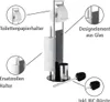 A toilet paper holder and toilet brush set with labels pointing out its features. Produktbild-Vorschau