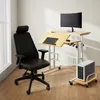 A home office setup with a desk, chair, and computer. Produktbild-Vorschau