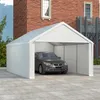 A white carport tent with a car inside, parked on a paved surface in front of a brick building. Náhled obrázku produktu