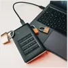 A Verbatim external hard drive is connected to a laptop, secured by three padlocks. Produktbild-Vorschau