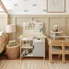 A child's playroom with a wooden workbench and toys. Produktbild-Vorschau