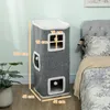 A grey cat tree tower is placed next to a bed in a bedroom. Produktbild-Vorschau
