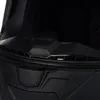 A close-up view of the top ventilation area of a black helmet. Anteprima dell’immagine prodotto