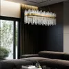 A modern living room with a large sectional sofa and a rectangular chandelier. Náhľad obrázku produktu
