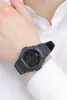 A person's wrist wearing a black digital watch. Produktbild-Vorschau