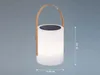 A solar-powered lantern with a wooden handle is shown against a textured gray background. Dimensions are indicated with dotted lines and text. Produktbild-Vorschau