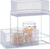 A silver mesh tiered shelf unit holding two glass jars filled with pasta. Produktbild-Vorschau