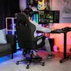 A person is playing a video game in a room with colorful lighting. Produktbild-Vorschau