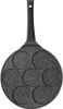 A top-down view of a black, speckled pancake pan with seven circular indentations, each designed to cook a small pancake or egg with a smiley face pattern. Produktbild-Vorschau