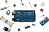 A collection of electronic components and a microcontroller board are arranged on a white background. Anteprima dell’immagine prodotto